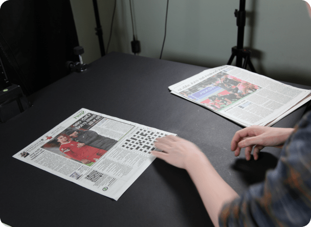 Historical Newspapers on Scanning Machine ready to be digitised by UK Archiving